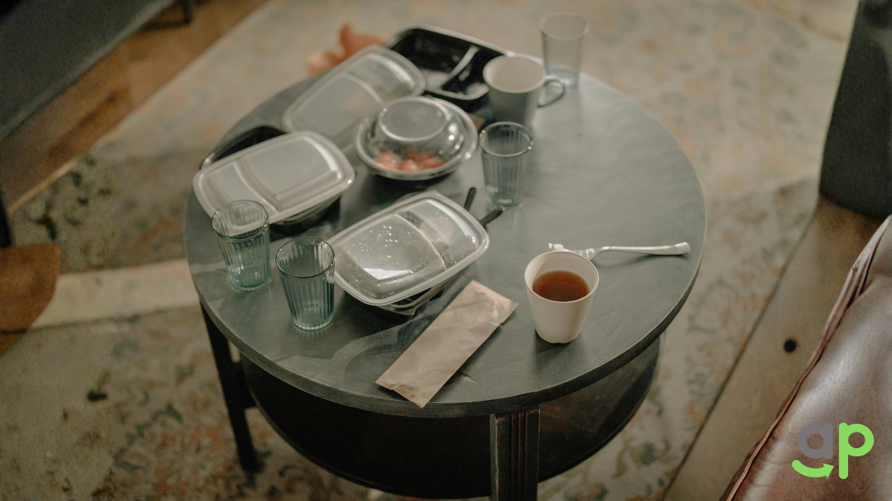 Fast food packed in single-use plastic boxes and wrapped in plastic film, showing convenience packaging commonly used for takeaway.