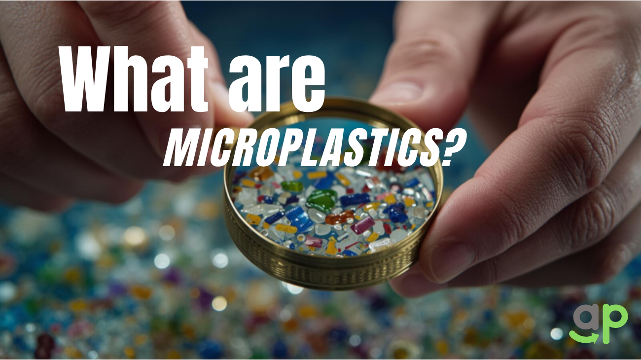 Concept image showing human hands holding magnifier showing visible microplastic